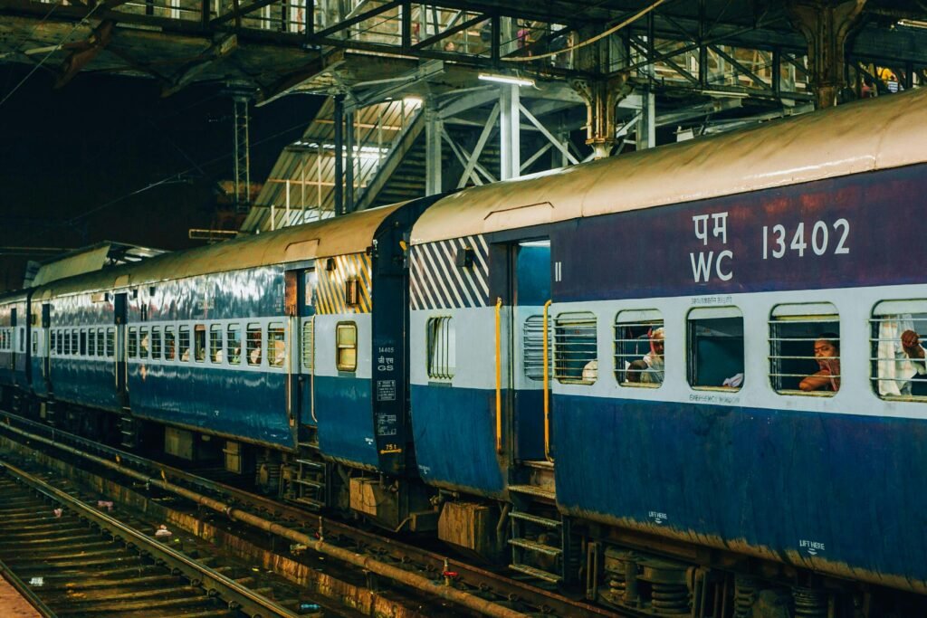 Indian passenger train at a station platform in India.