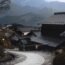 Stone path through traditional houses in a Japanese mountain village