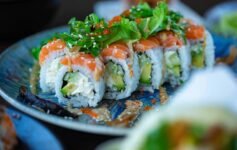 Assortment of popular Japanese foods including sushi, tempura, ramen, and traditional dishes