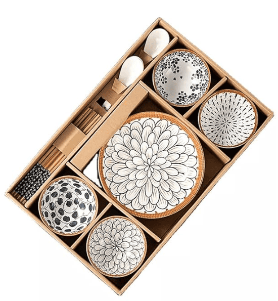 Assorted kitchen utensils and tools, including knives, spoons, cutting boards, and cookware