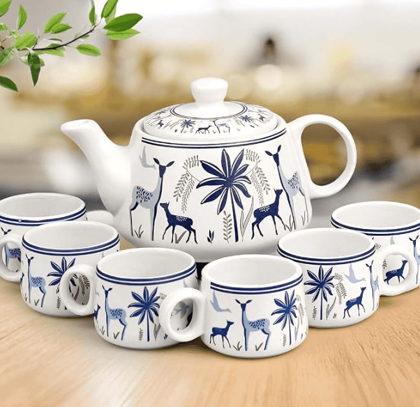 Assorted tea set with teapot, matching teacups and saucers