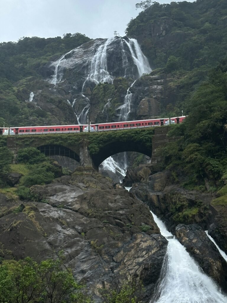 Dudhsagar Waterfalls cascading down rocky cliffs in the Western Ghats near Goa during monsoon
