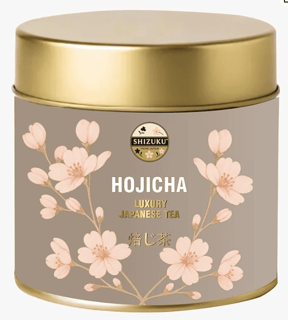 A steaming cup of reddish-brown hōjicha tea.