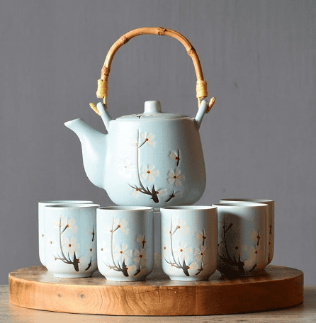 A set of ceramic teapots arranged together.