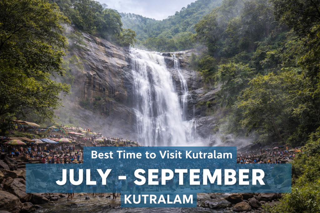 Kutralam waterfalls in full flow during the monsoon season with visitors bathing